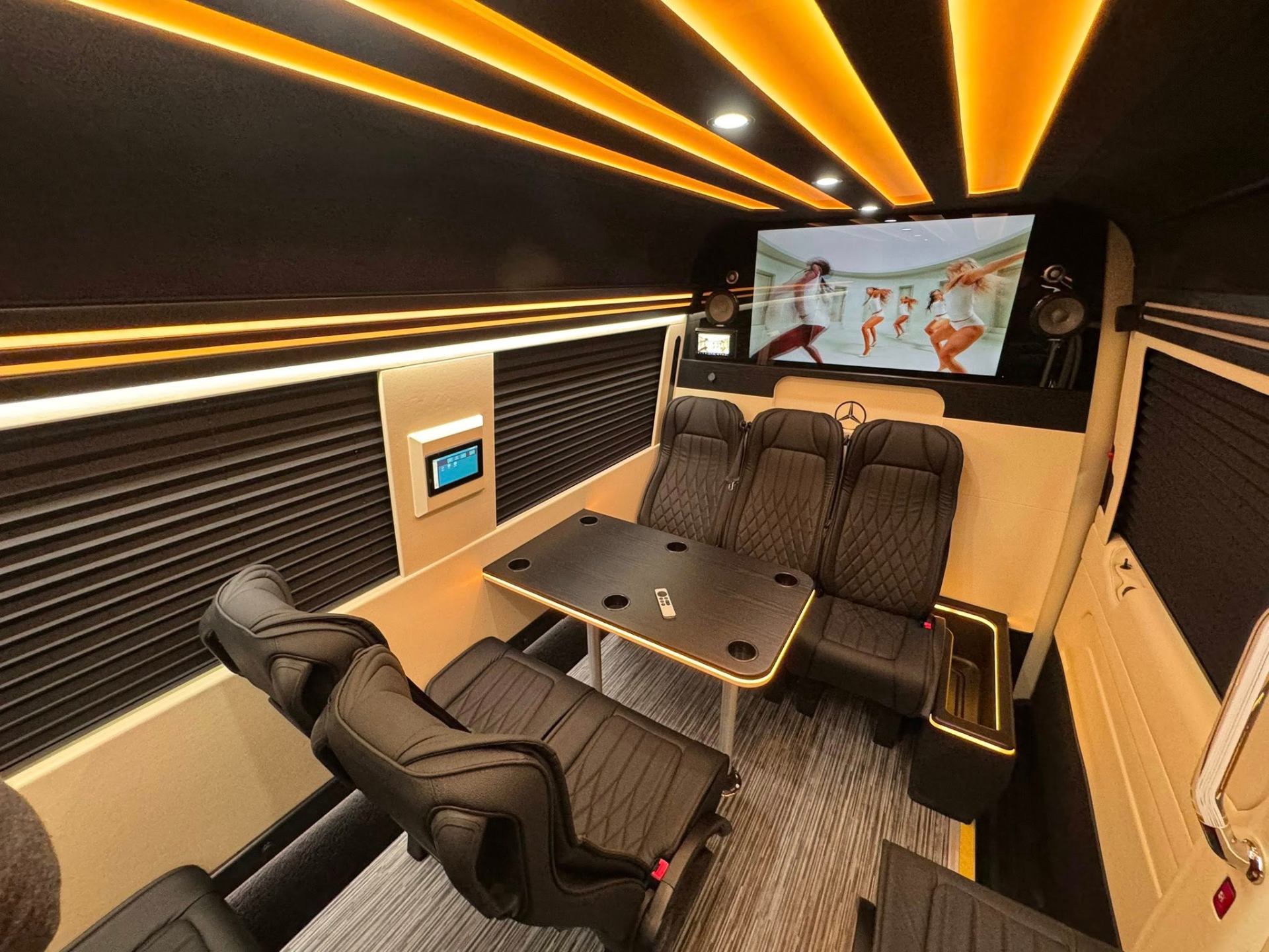 Executive Sprinter with amber lighting and entertainment screen