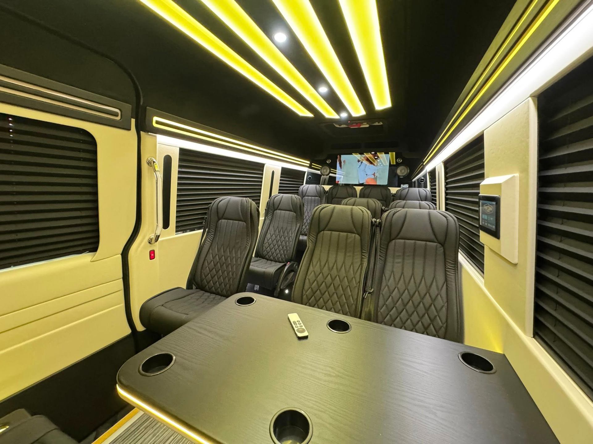 Executive Sprinter cabin with yellow ceiling lighting
