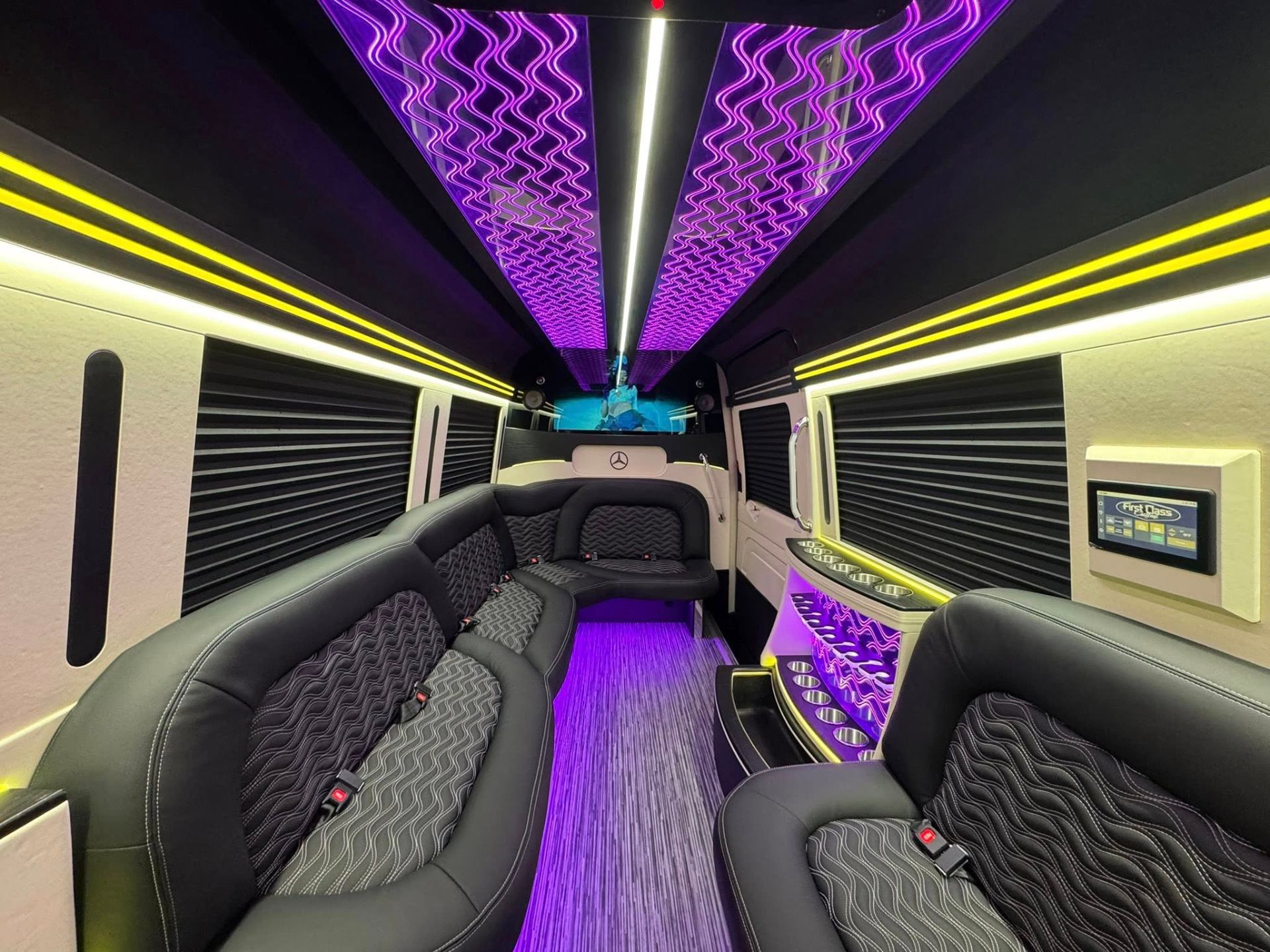 Interior of Mercedes-Benz Sprinter Limo with lounge seating and ambient lighting for Atlanta groups